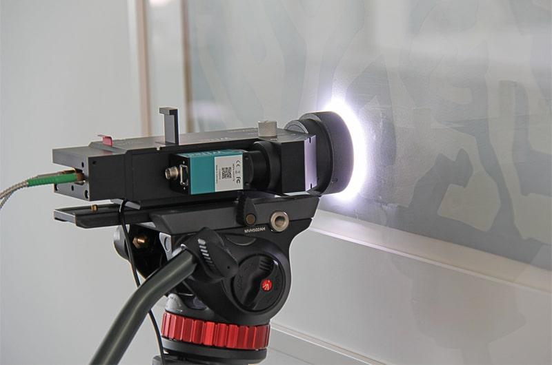 alphaCART Raman probe positioned in front of a framed picture